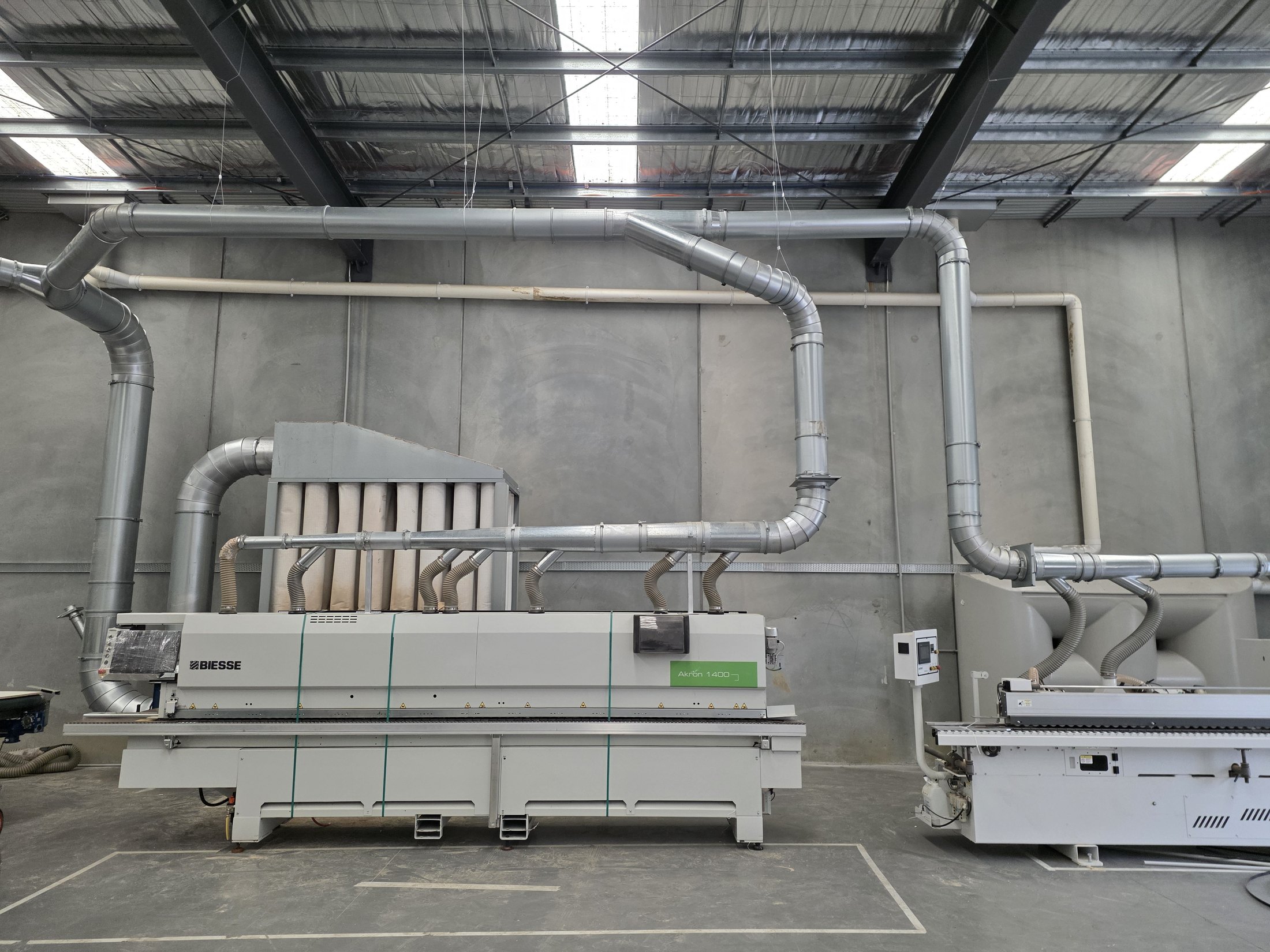 Industrial dust extraction ducting connected to workshop machinery