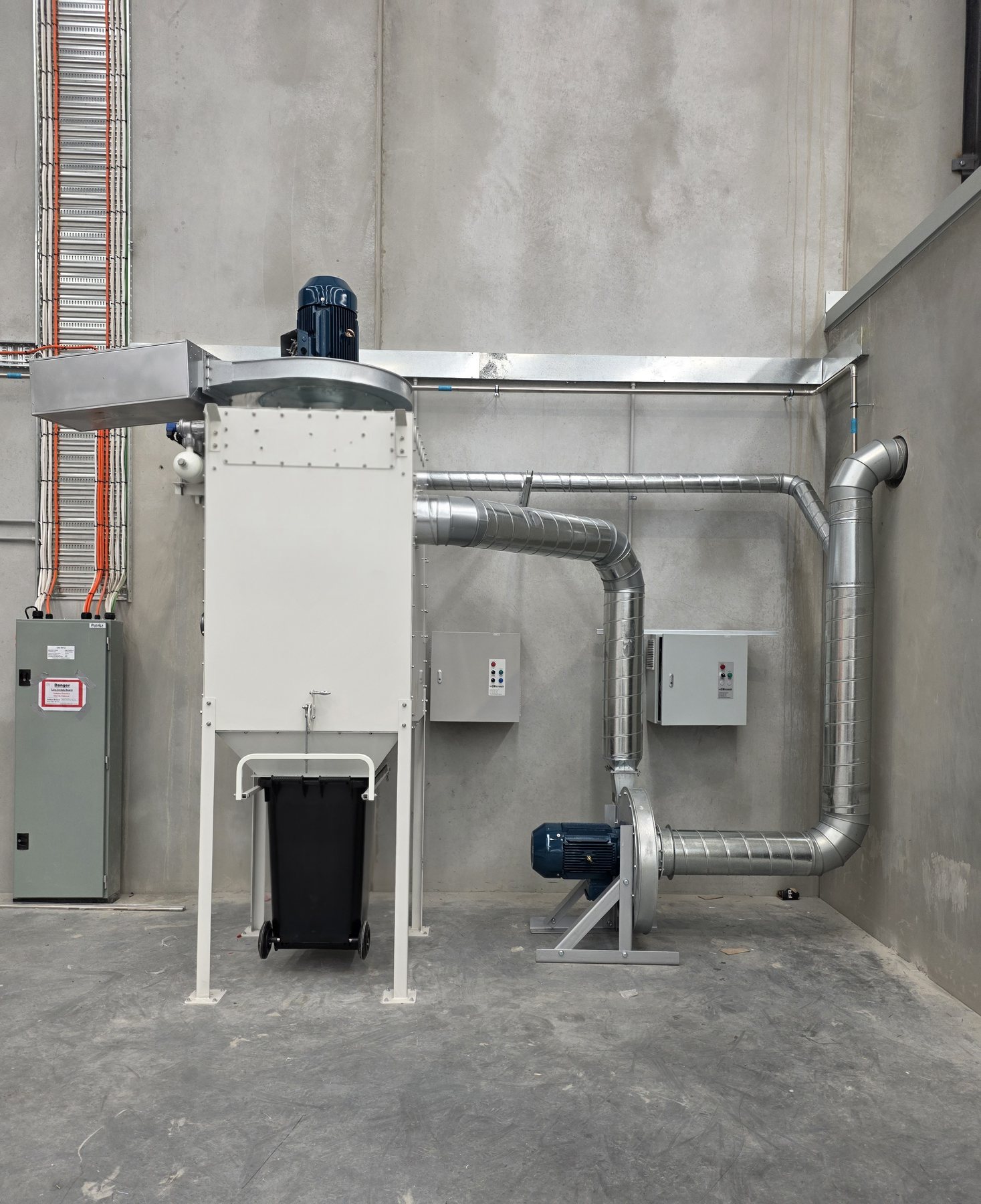 Makita Melbourne warehouse dust extractor with ducting and exhaust fan connections