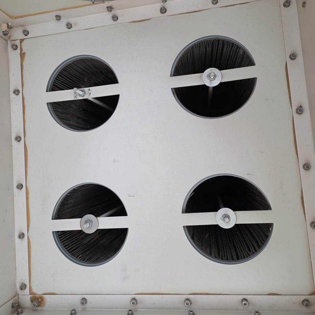 Dust extractor filter openings after servicing with dust build-up removed