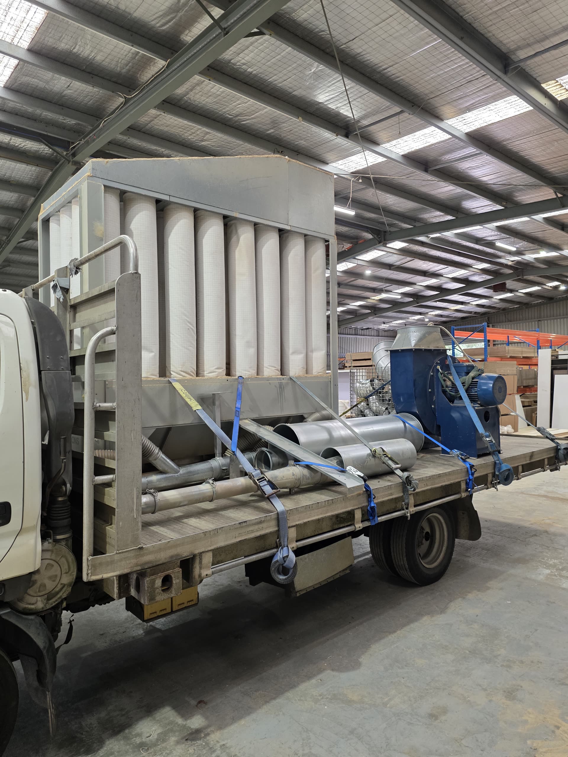 Dust extraction unit loaded on a flatbed truck ready for relocation to a new site